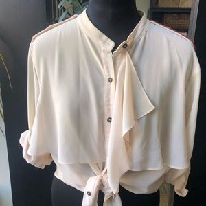 Blush colored ruffle blouse with beaded shoulders